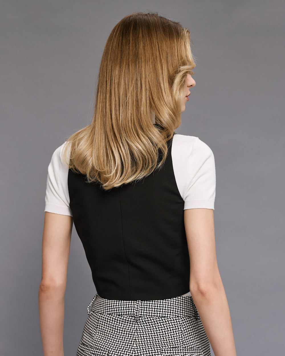 Gilet pied-de-poule con retro unito