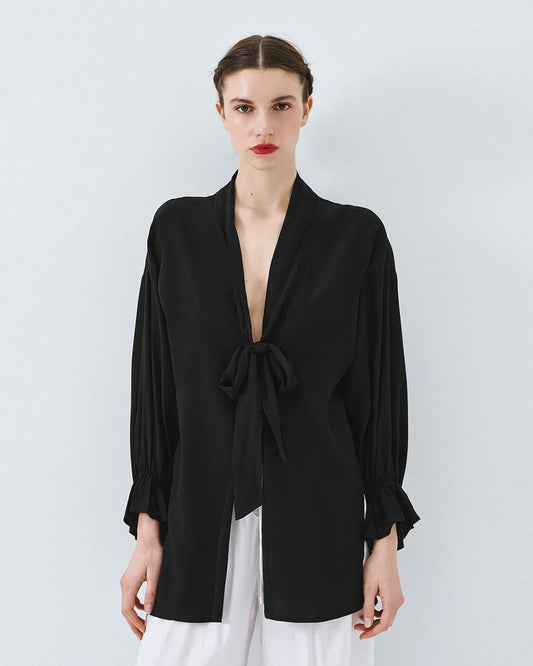 Kimono shirt with tie closure and flounced sleeves.