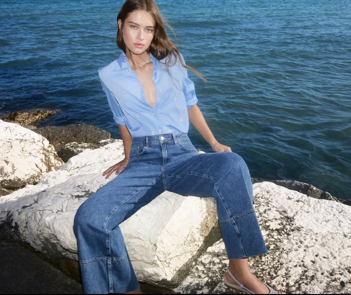 Jeans a trombetta con orlo impunturato