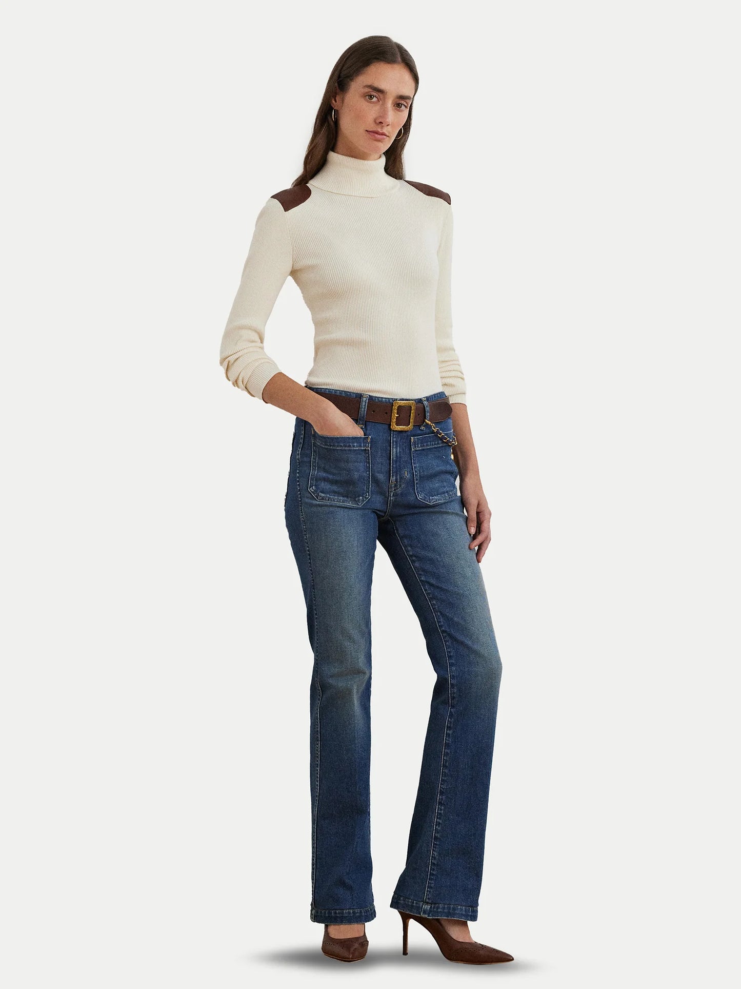Turtleneck sweater with faux leather flaps. Camel
