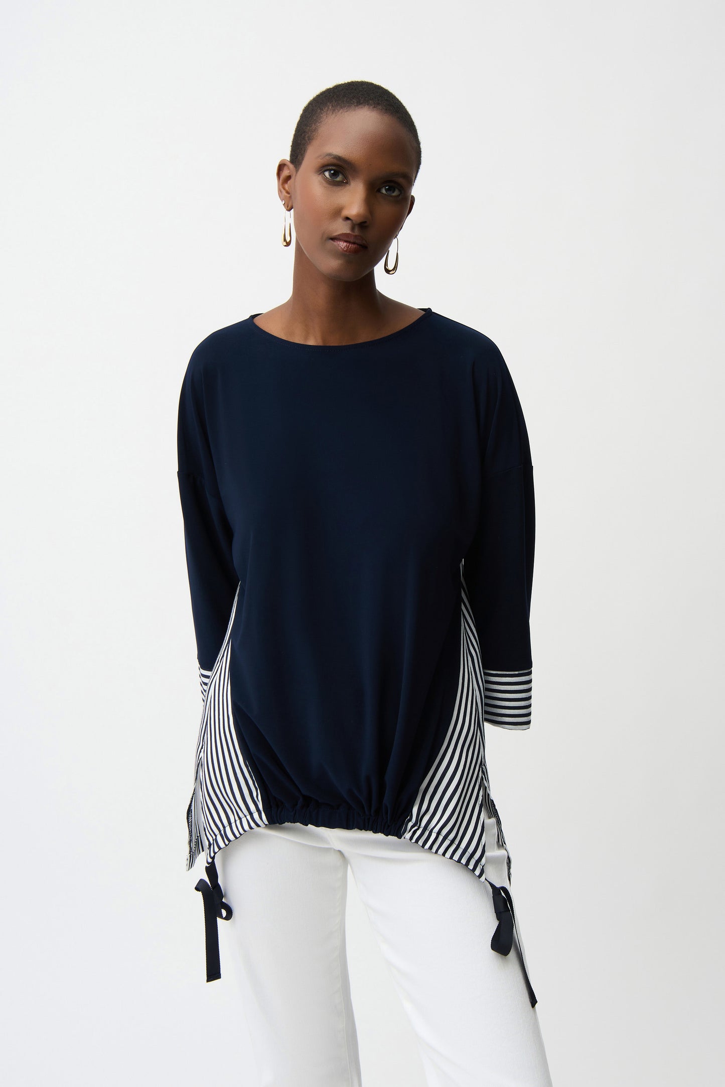 Blusa fluida a contrasto con motivo a righe