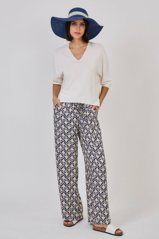 Pantaloni a gamba larga con stampa arabesque -  beige e nero o beige e blu