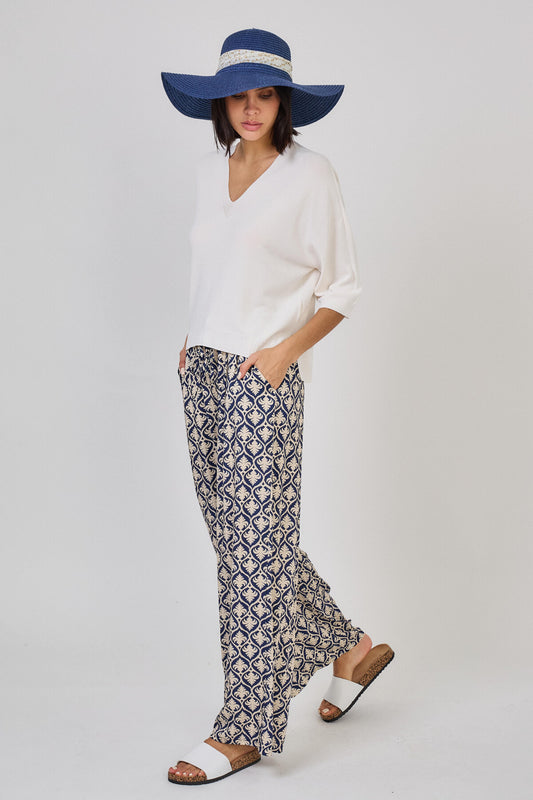 Pantaloni a gamba larga con stampa arabesque beige e blu