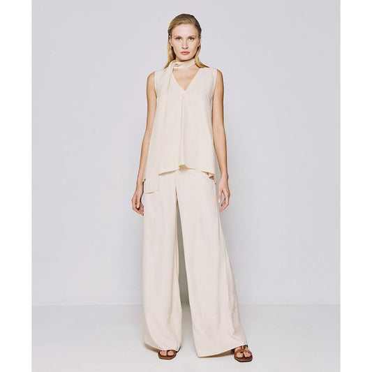 Eleganza Versatile in Color Vaniglia: Blusa Smanicata