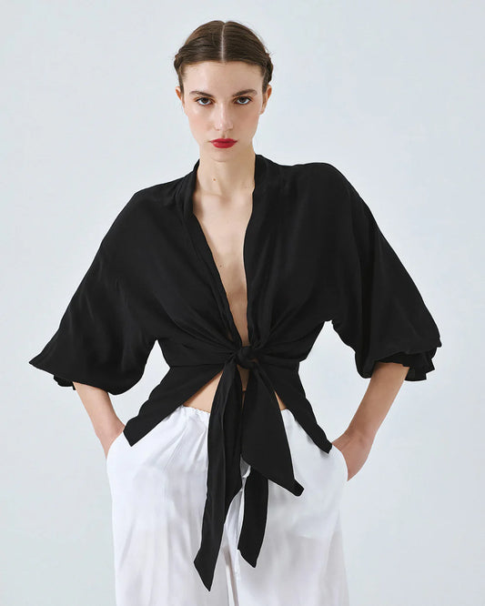 Kimono shirt with tie closure and flounced sleeves.