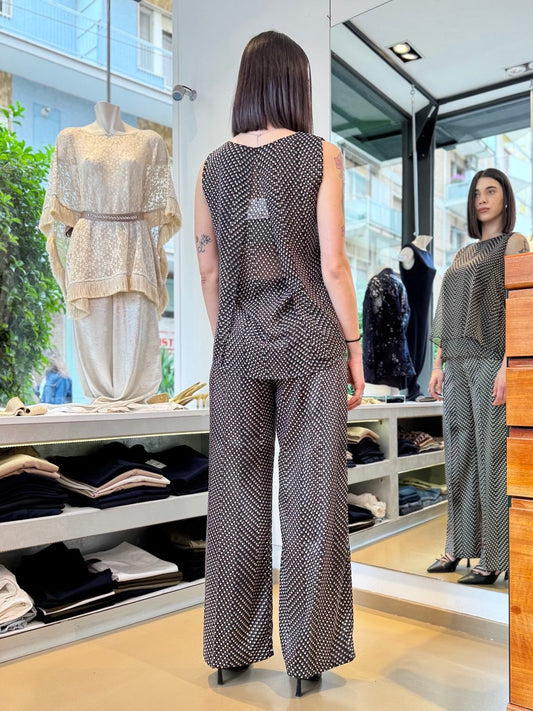 Pantaloni neri a pois con gamba fluida